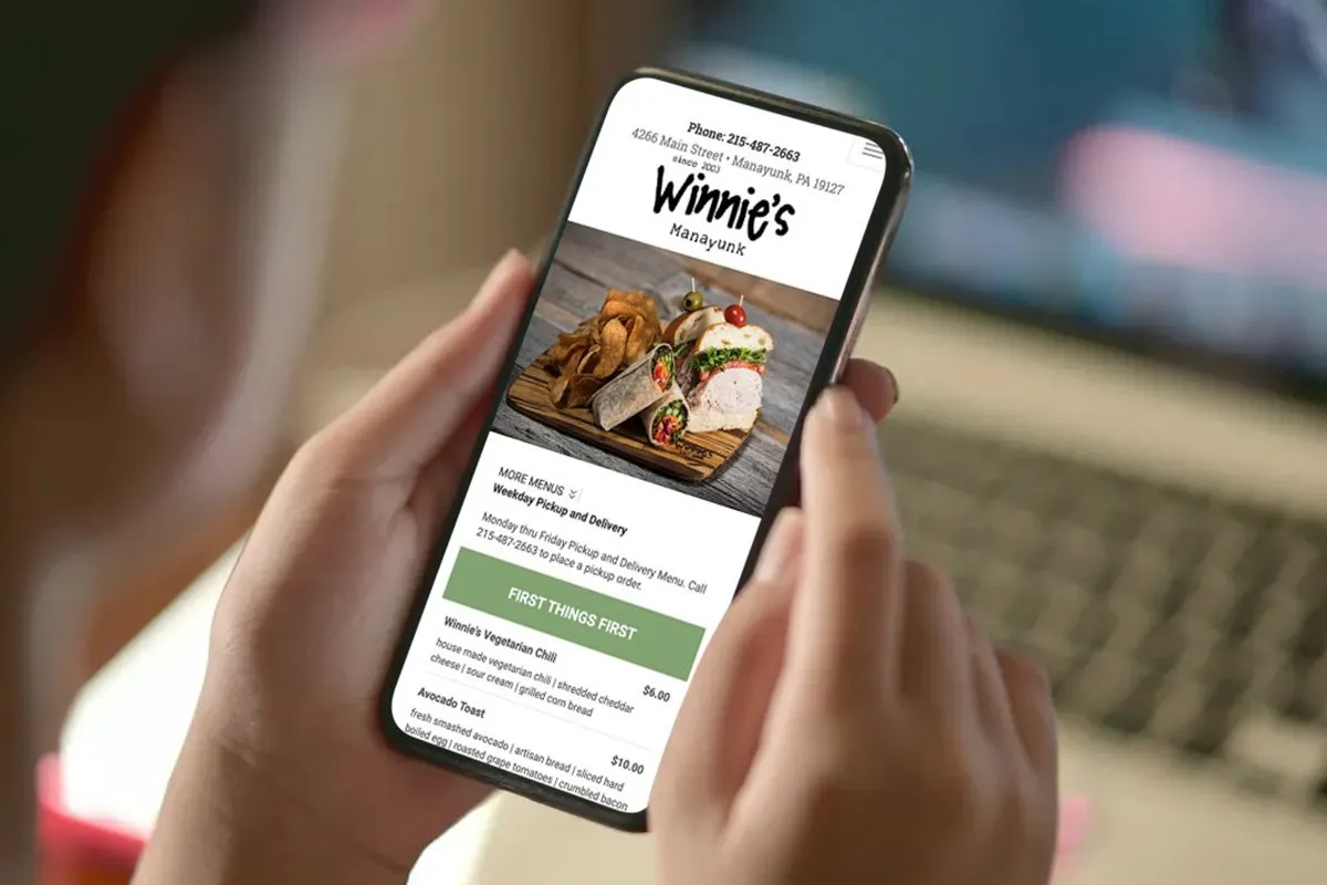 Blue Blaze custom website shown on a phone for Winnie's in Philadelphia
